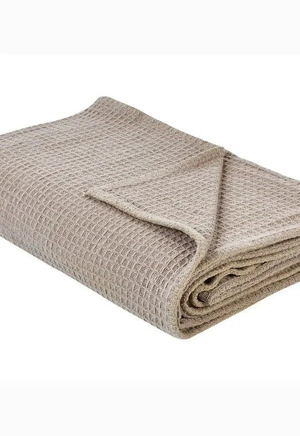 Stilriktig sängkläder i beige färg gjord i bomull.