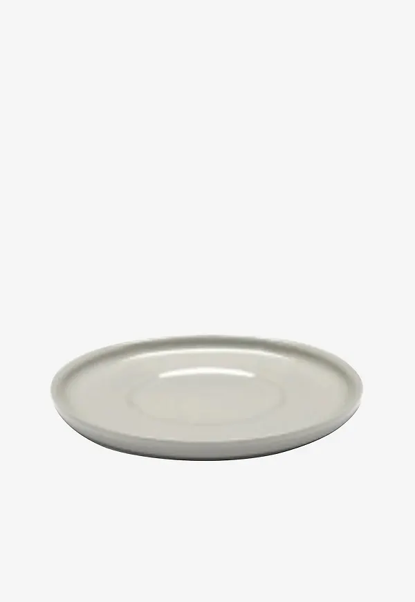 Beige Serax-underlägg i söt modell.