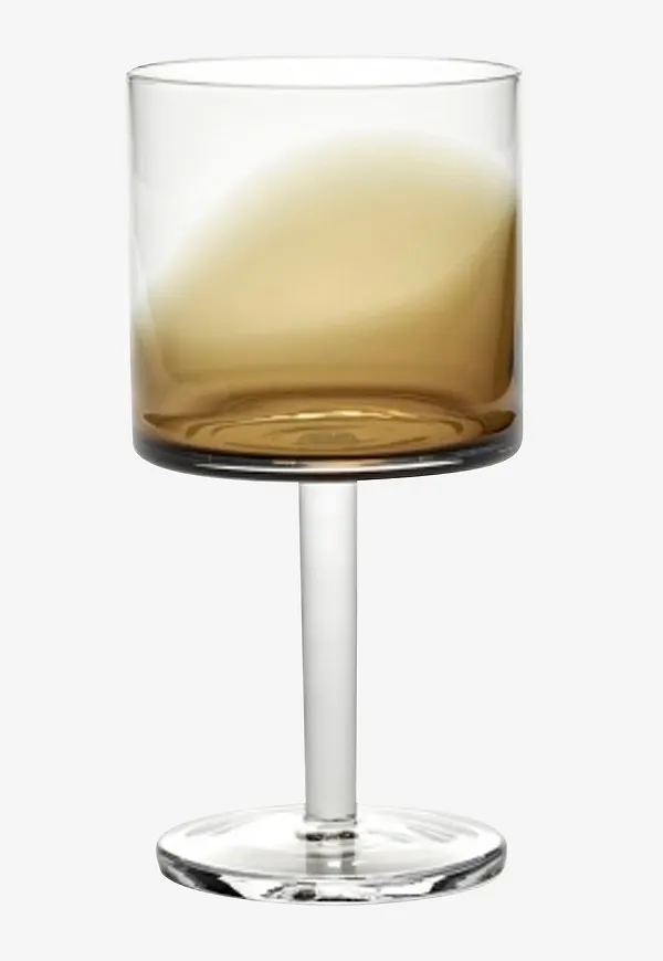 Brun Serax-vitvinsglas i fin modell.