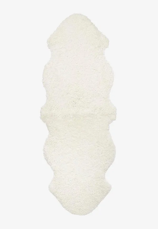 Härlig vit matta i fårskinn från Skinnwille.