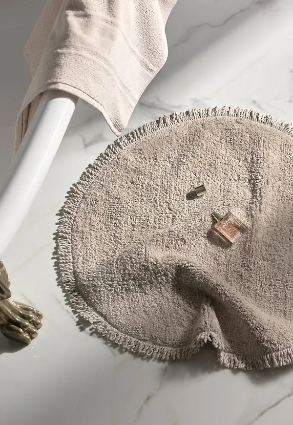 Söt bomullsmatta i beiget från Staycation.