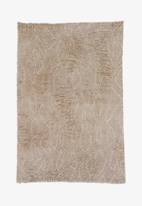 Riktigt fin matta i beige färg gjord i ull.