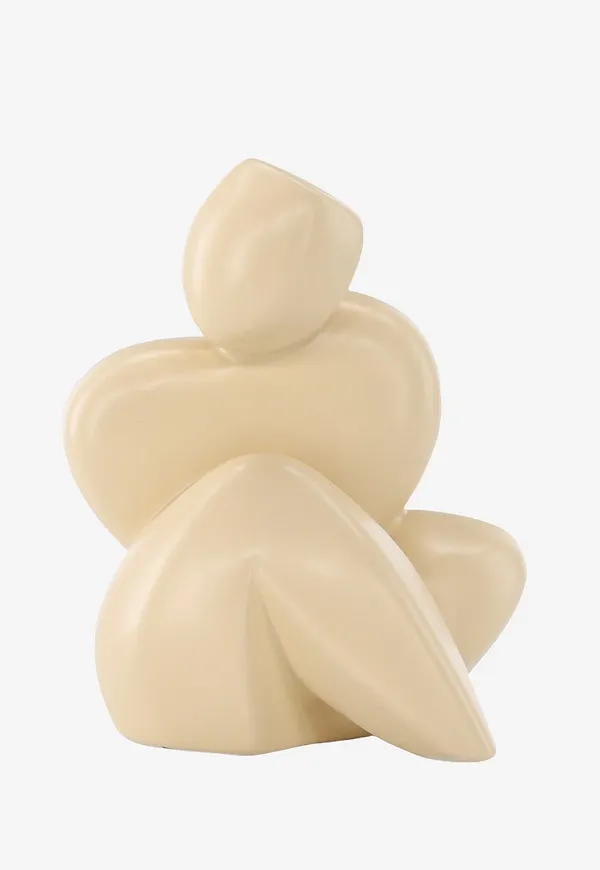 Komfortabel skulptur i gult från Venture Home.