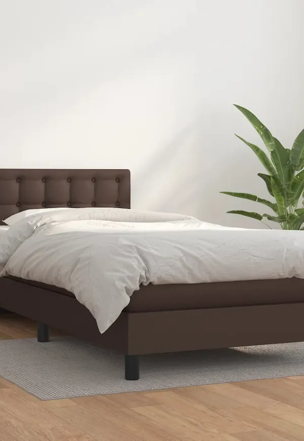 Fantastiskt snygg vidaxl säng i brun färg gjord i bomull.