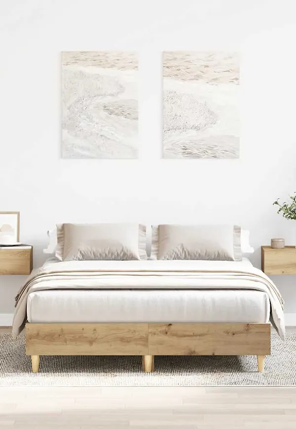 Söt vidaxl säng i brun färg gjord i ek.