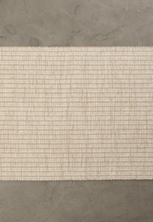 Fin beige ullmatta 2025 från Woven Works.