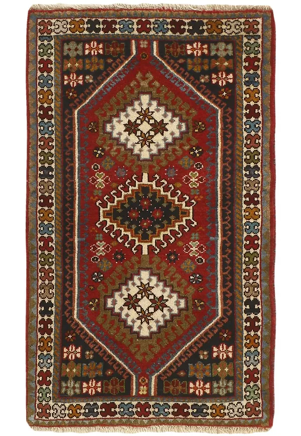 Härlig ullmatta i rött från Rezas.