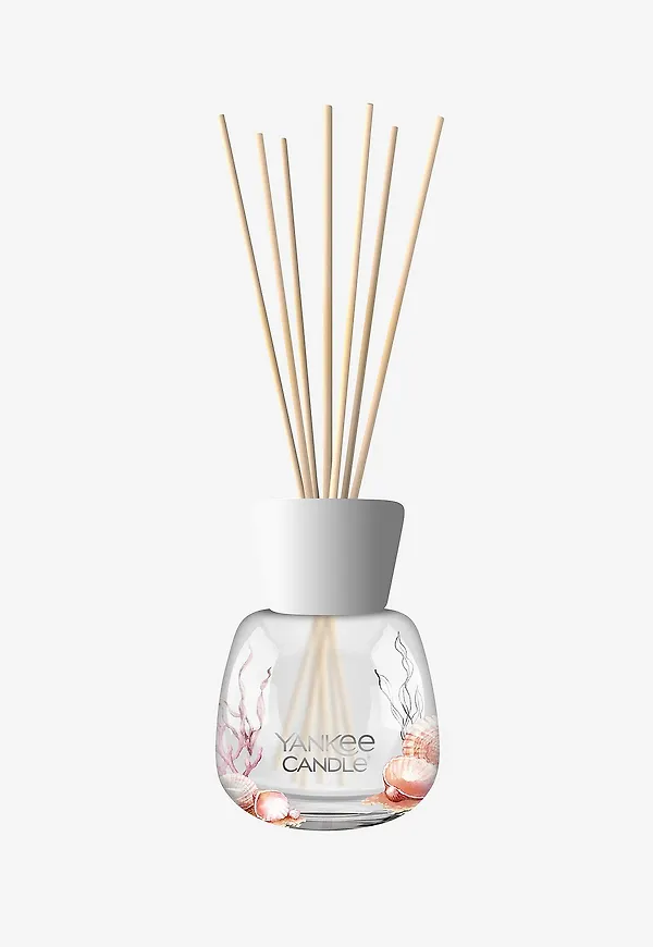 Rosa Yankee Candle-doftpinne i smickrande modell.